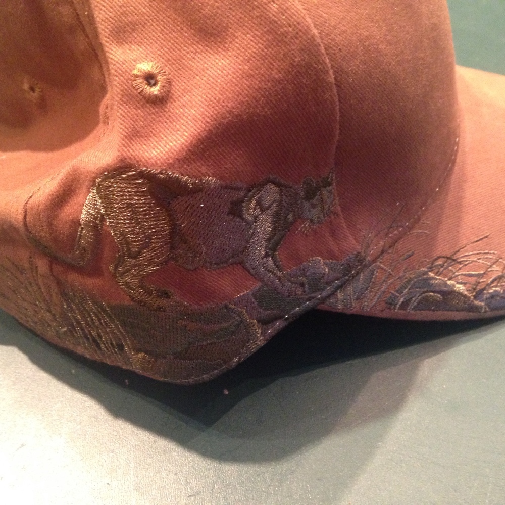 Brown hat with mountain lion